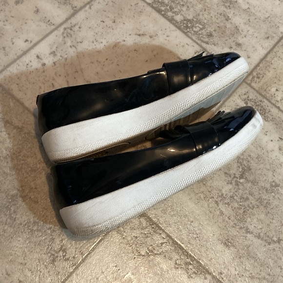 Fit flip black shiny frilly loafers style black shed with small mark on one toe. - Picture 5 of 10